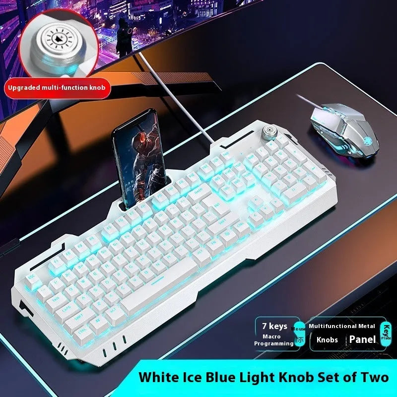 Aluminium gaming keyboard with volume knob, shown in metal grey with RGB lighting alongside optional macro mouse and headset.