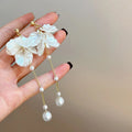 Women's shell pearl tassel earrings with four clip options measuring 8.8cm length