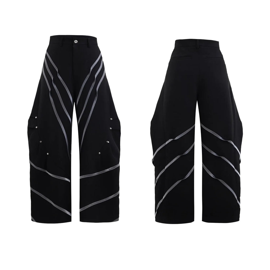 Men's polyester trousers with three-dimensional cut, metal striped rivets, and pleated front.