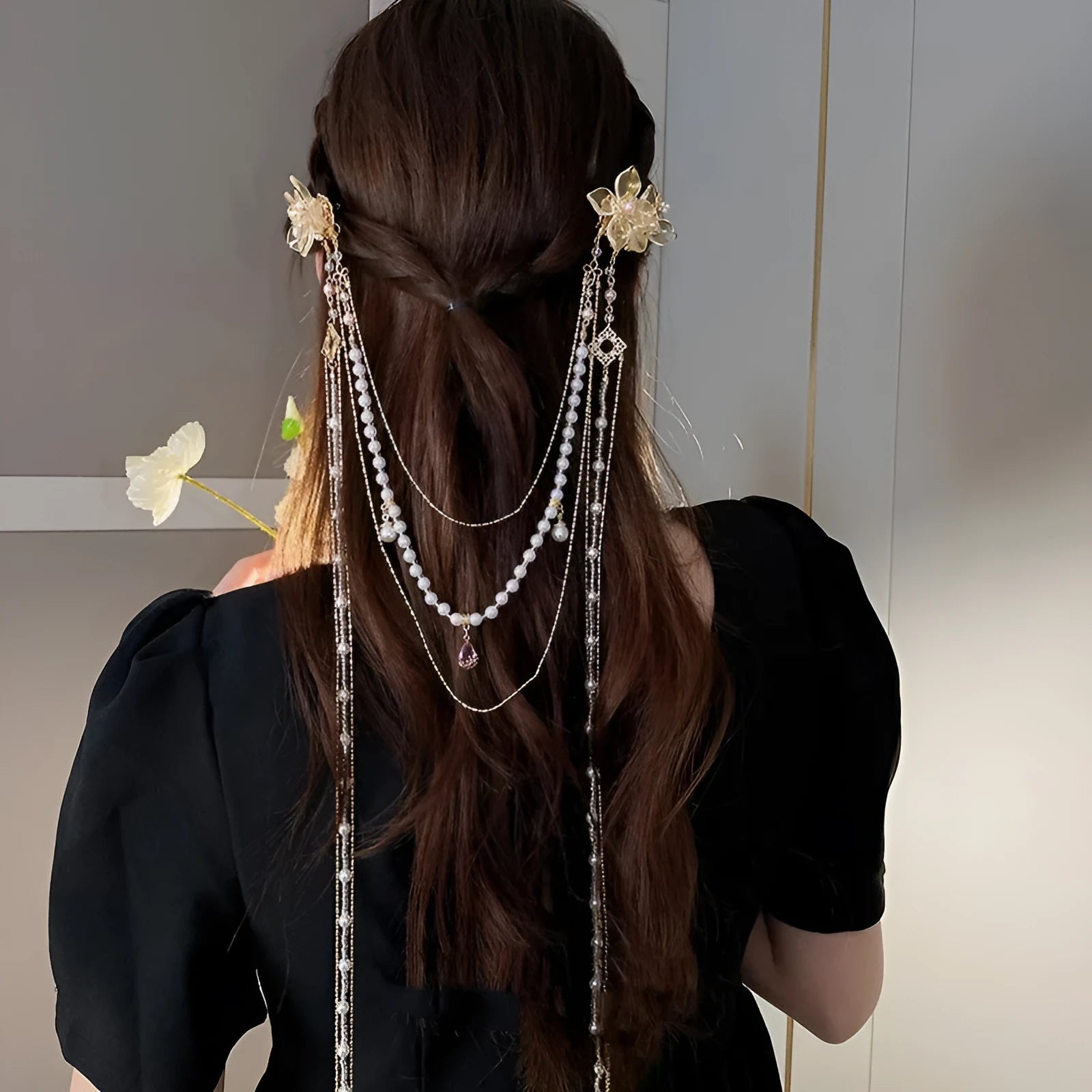 Gold women's hairpin with acrylic pearl, diamond flower decoration, and long dangling tassel.