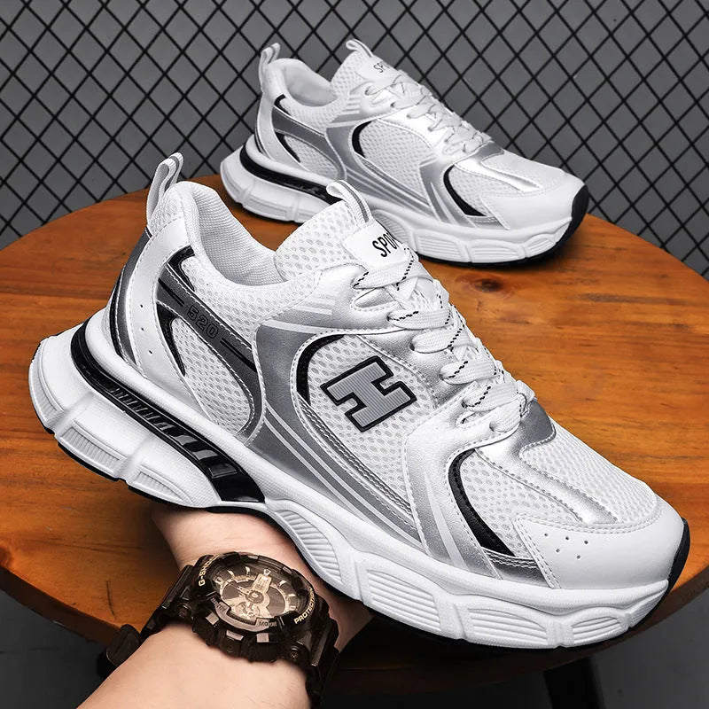 Men's solid-colour mesh running shoes with round toe and plastic sole.