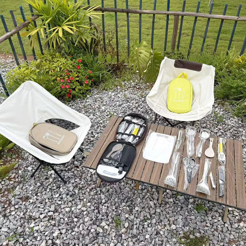 12-piece stainless steel portable picnic kitchenware set in a khaki storage bag.