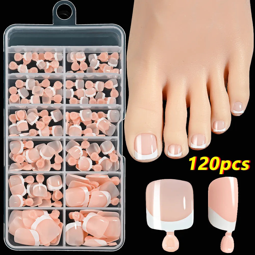 Box of 120 French white edge press-on toe nails in full square short shape showing multiple nude shades.