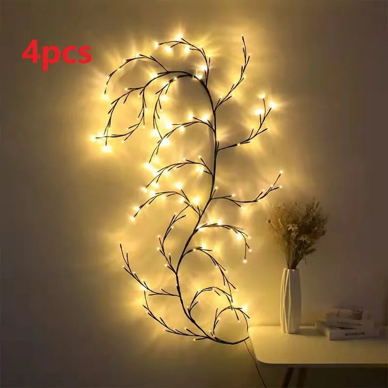 Flexible birch bark textured LED willow vine garland bent into shape with warm white lights.