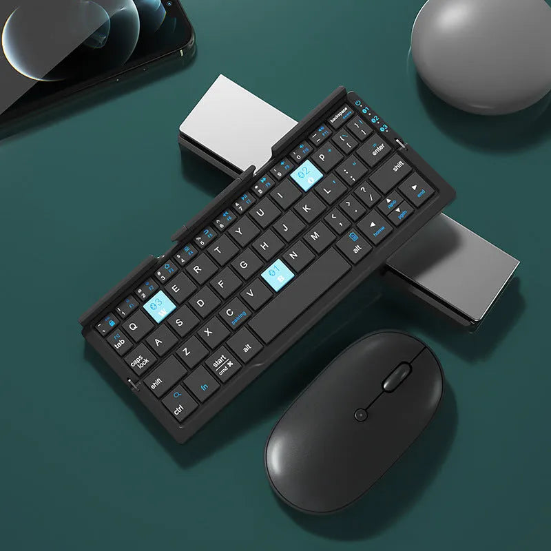 Silver white folding Bluetooth keyboard with hidden stand supporting smartphone, shown open and closed