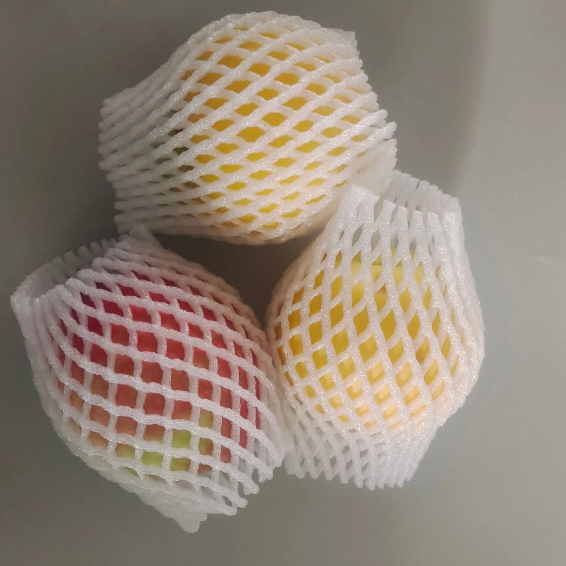 White foam fruit net cover protective case showing shockproof material and multiple size options