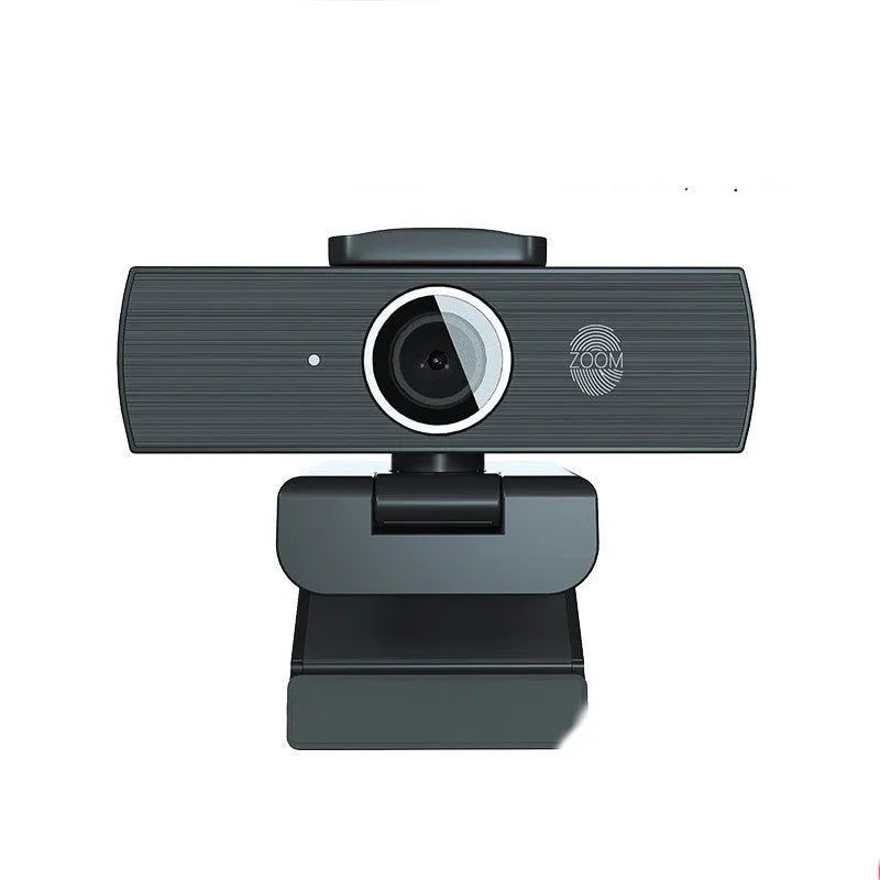 Black 8MP 4K USB computer webcam with magnetic privacy cover on a desktop