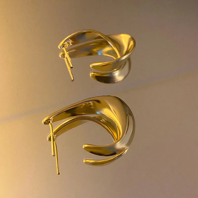 Twisted geometric metal earrings with electroplated gold or silver finish