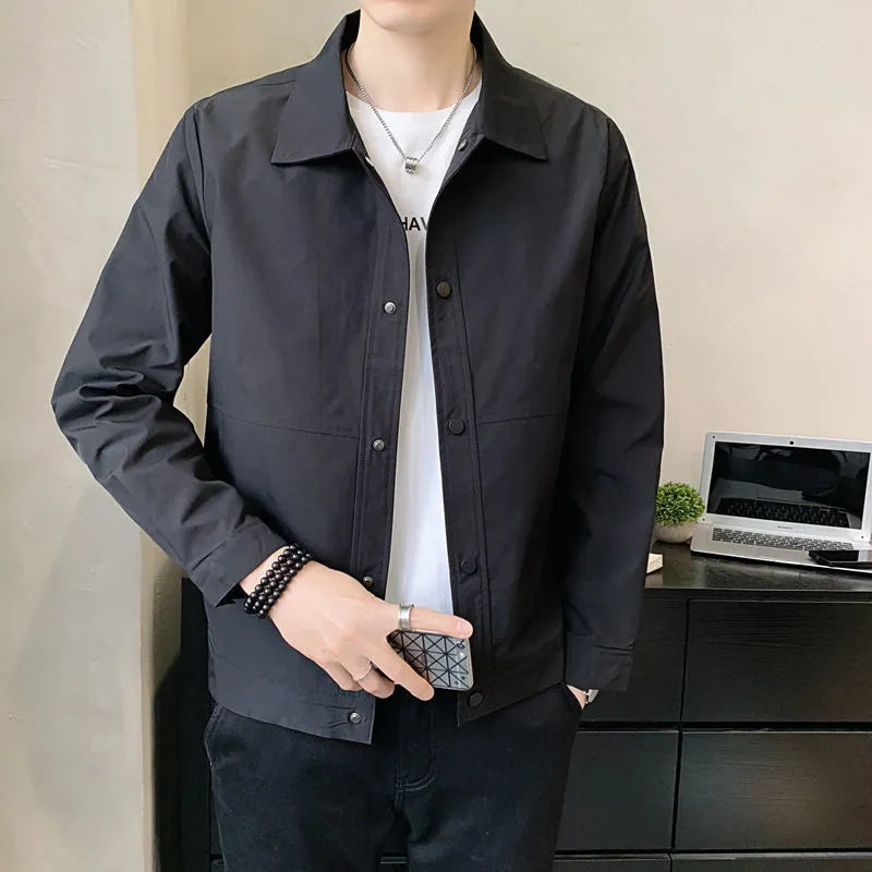 Man wearing a Korean style thin single-layer polyester jacket in light gray.
