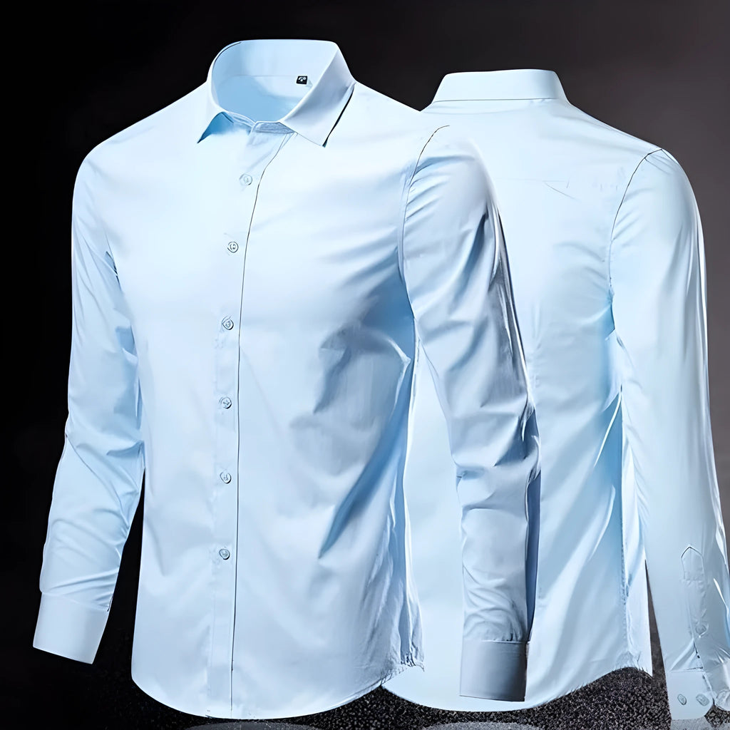 Man wearing a loose fit long-sleeve linen shirt in a neutral colour, showcasing the casual silhouette.
