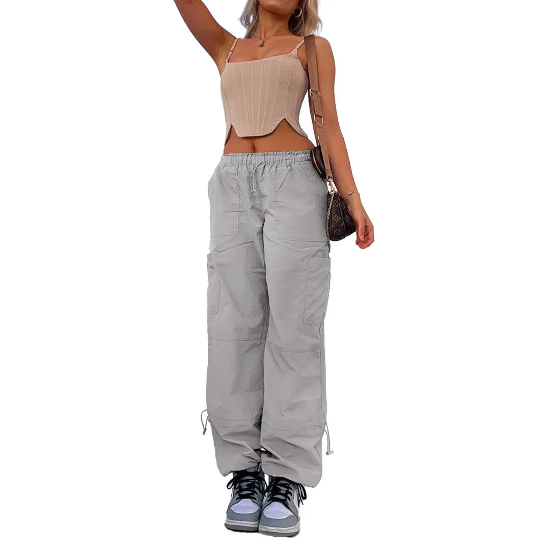 Men's straight-leg cargo trousers in khaki with multiple pockets, showing loose fit and mid-waist design