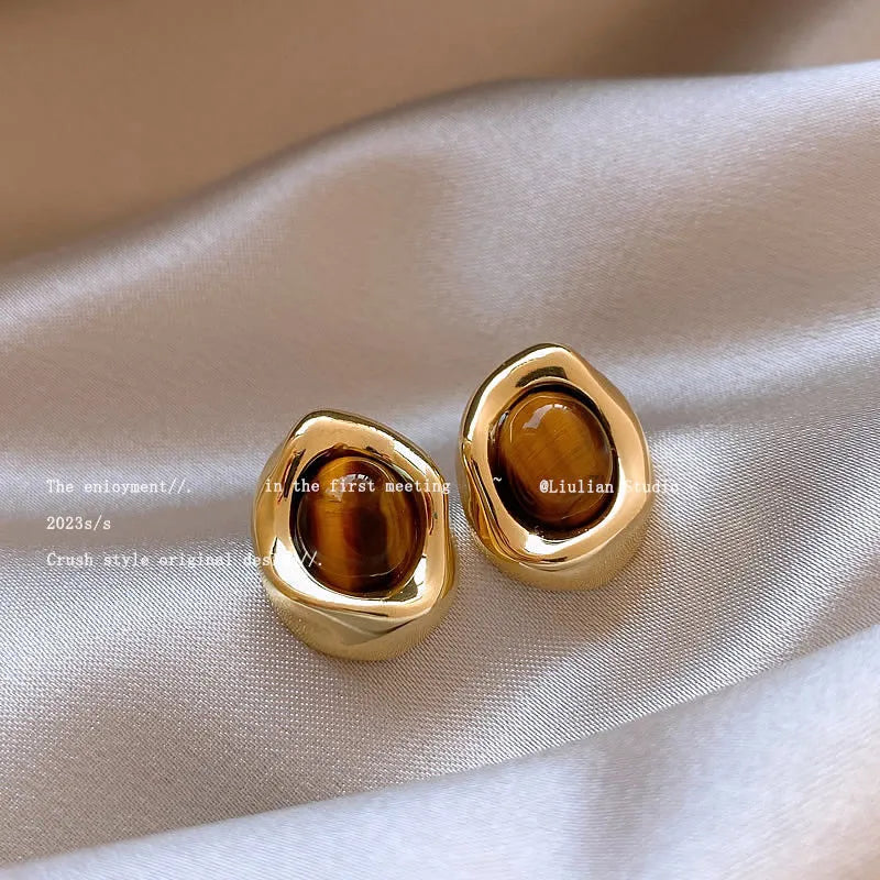 Handmade alloy holiday earrings set showing three geometric styles with tassel detailing