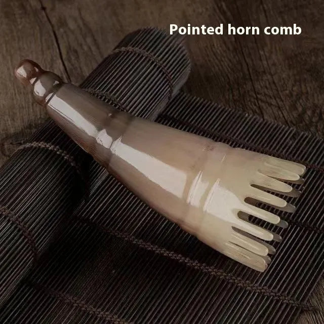 Black buffalo horn comb with wide teeth and fine teeth for head massage.