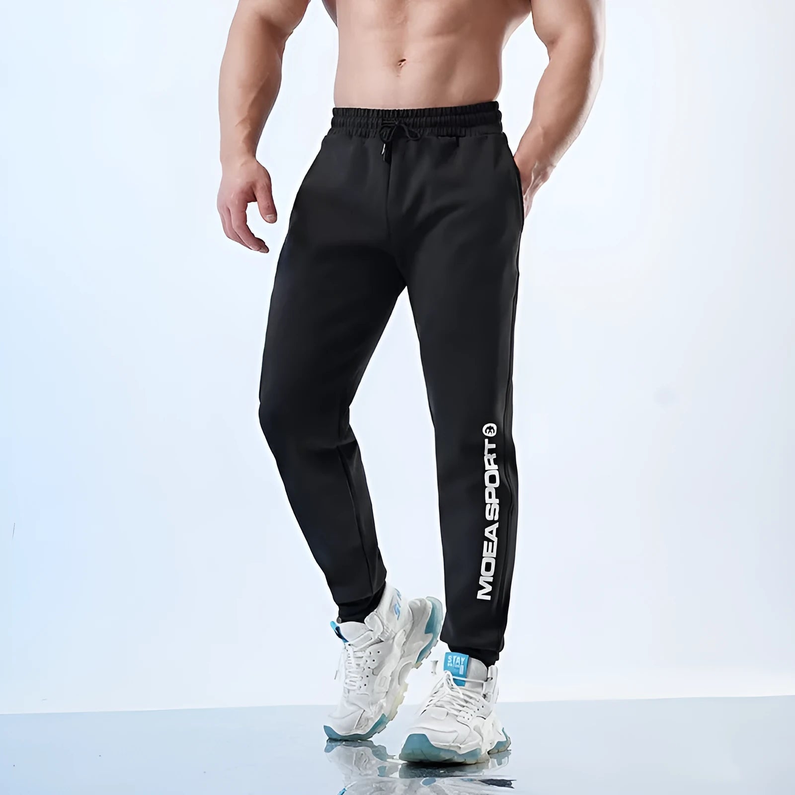 Men's ankle-tied sweatpants in polyester-spandex blend with fleece-lined colour options