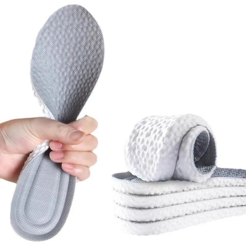 A pair of grey breathable PU sports insoles on a white background, showing a textured surface.