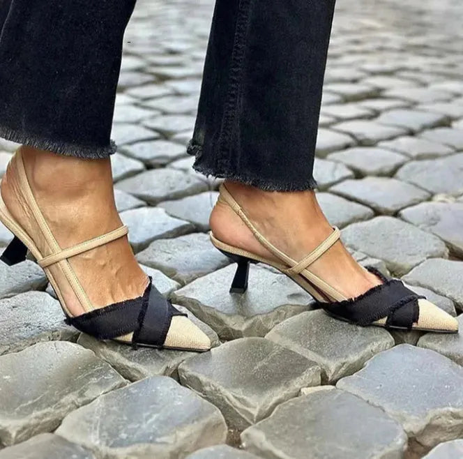 Apricot and black colour block women's stiletto heel sandals with pointed toe and buckle strap.