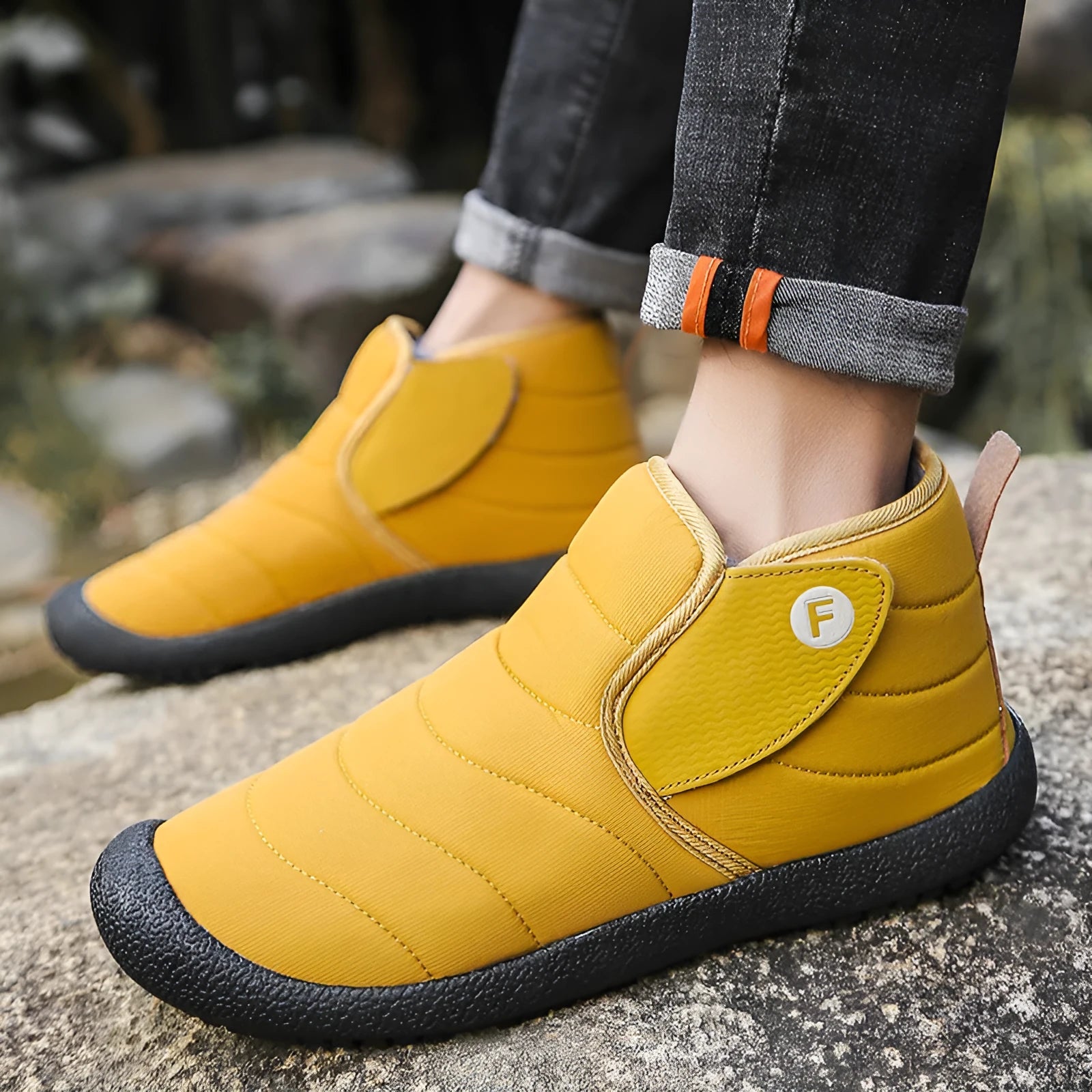 Men's thick cotton snow boots with a non-slip rubber sole in black, shown on a hard surface.