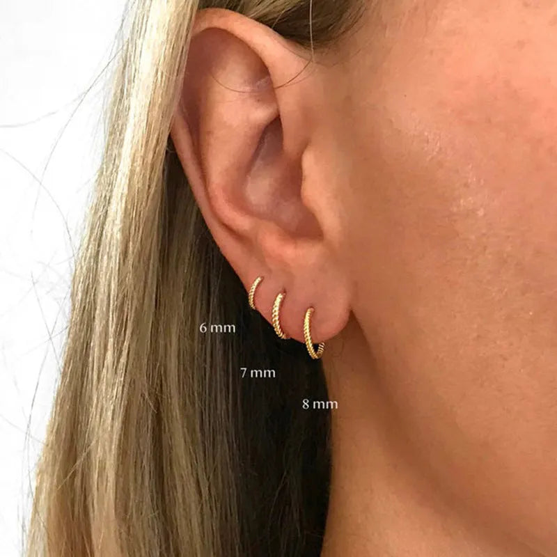 Sterling silver twisted ring earrings in geometric round design with gold or platinum finish