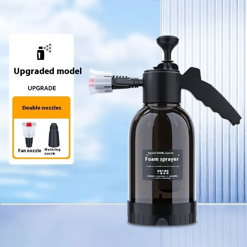 Black plastic 2-litre foam watering can sprayer with handle and spray nozzle.