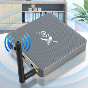 Android smart TV box set-top unit with remote control on a wooden table