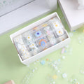 Five rolls of transparent adhesive tape with Midsummer Daisy cartoon decoration on a clear background.