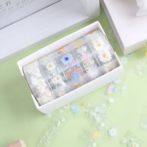 Five rolls of transparent adhesive tape with Midsummer Daisy cartoon decoration on a clear background.