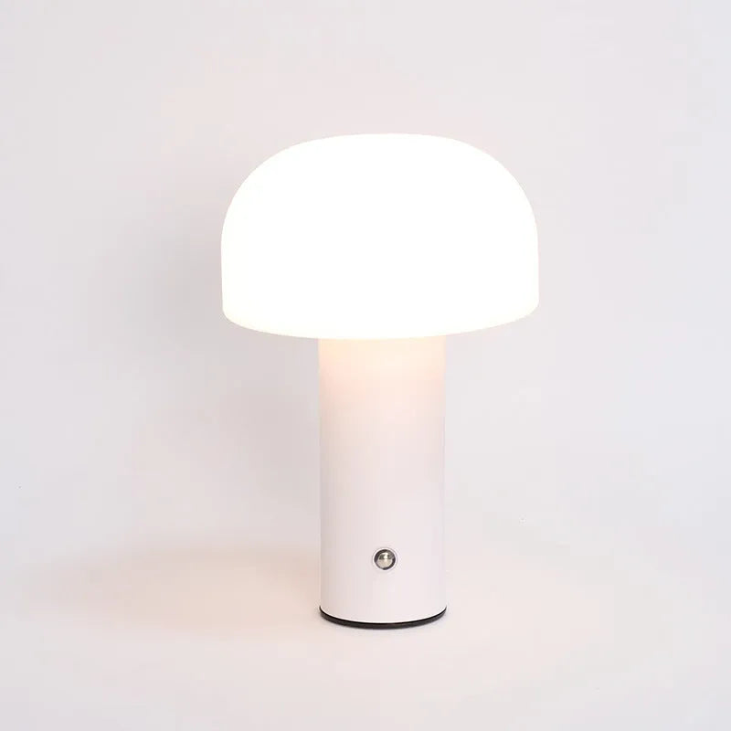 A USB-powered decorative table lamp in a choice of white, black, orange, or green colours.