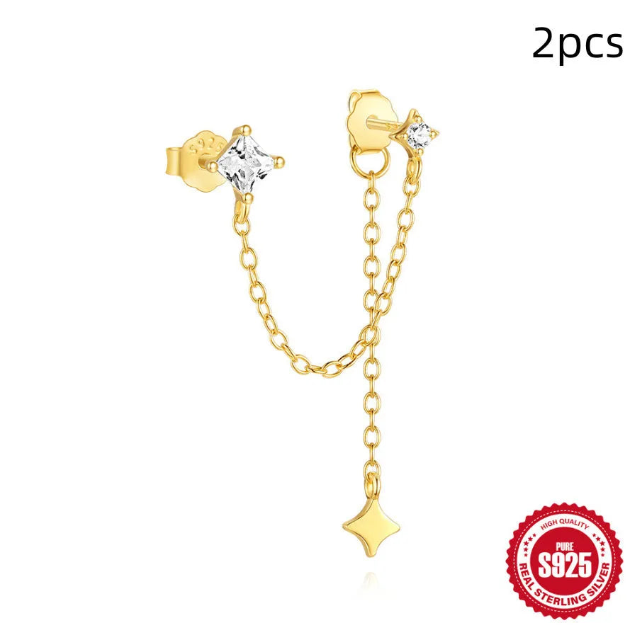 S925 sterling silver geometric stud earrings with inlaid zircon in golden clover, crown, and chain designs.