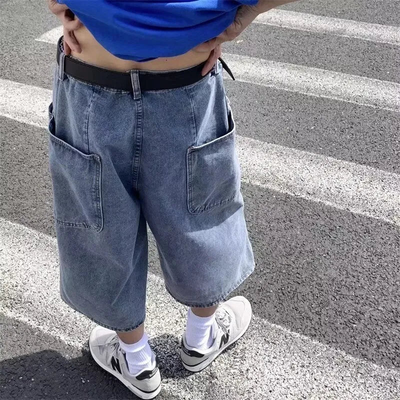 Men's blue washed denim cropped pirate shorts with a high waist and straight legs.