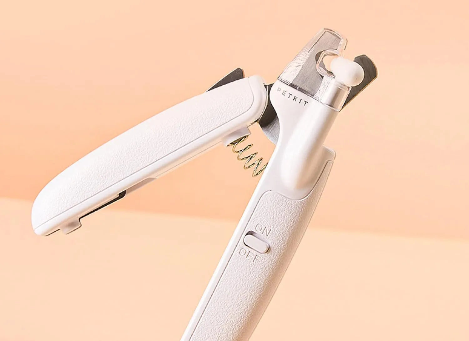 White pet nail clippers with LED light, transparent anti-splash baffle, and triangular steel blades for cats and dogs