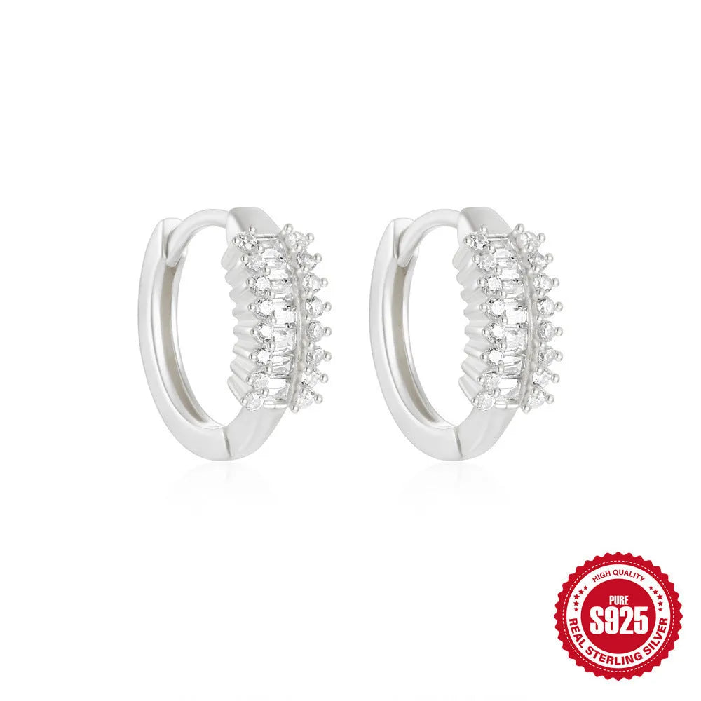 Sterling silver geometric stud earrings with small round design elements in gold or silver finish