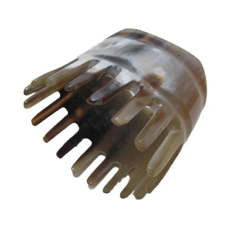 Black buffalo horn comb with wide teeth and fine teeth for head massage.