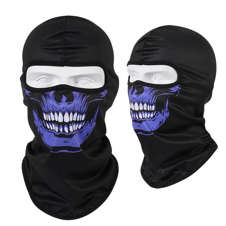 Breathable Bakool silk motorcycle skull mask in a graphic design, laid flat showing its 36cm by 29cm size.