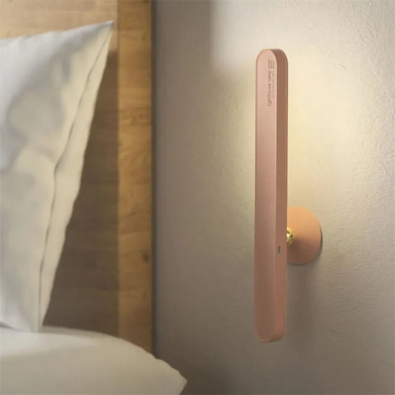 White geometric USB desk lamp with magnetic base shown on a wooden desk.