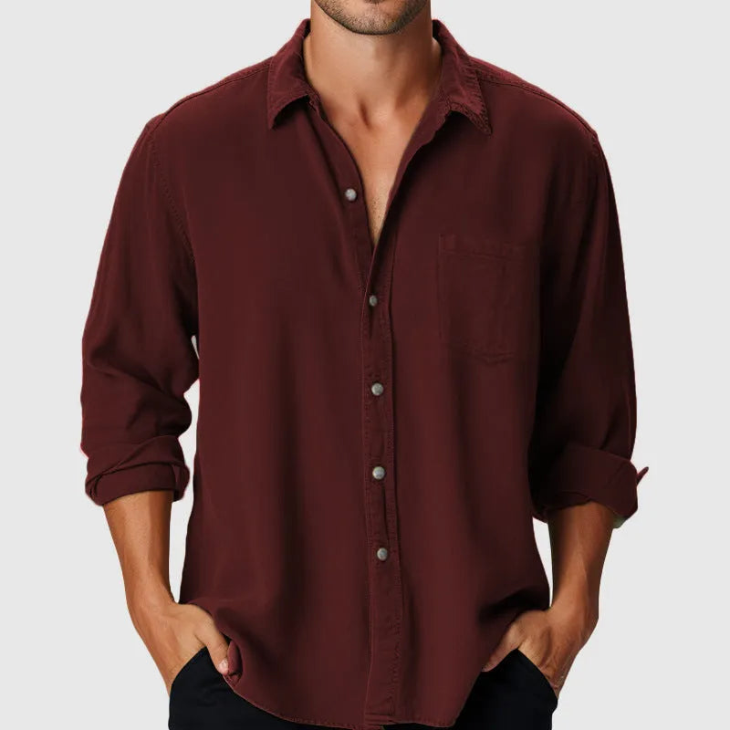 Men's loose fit polyester beach shirt with stand collar and long sleeves on a hanger.