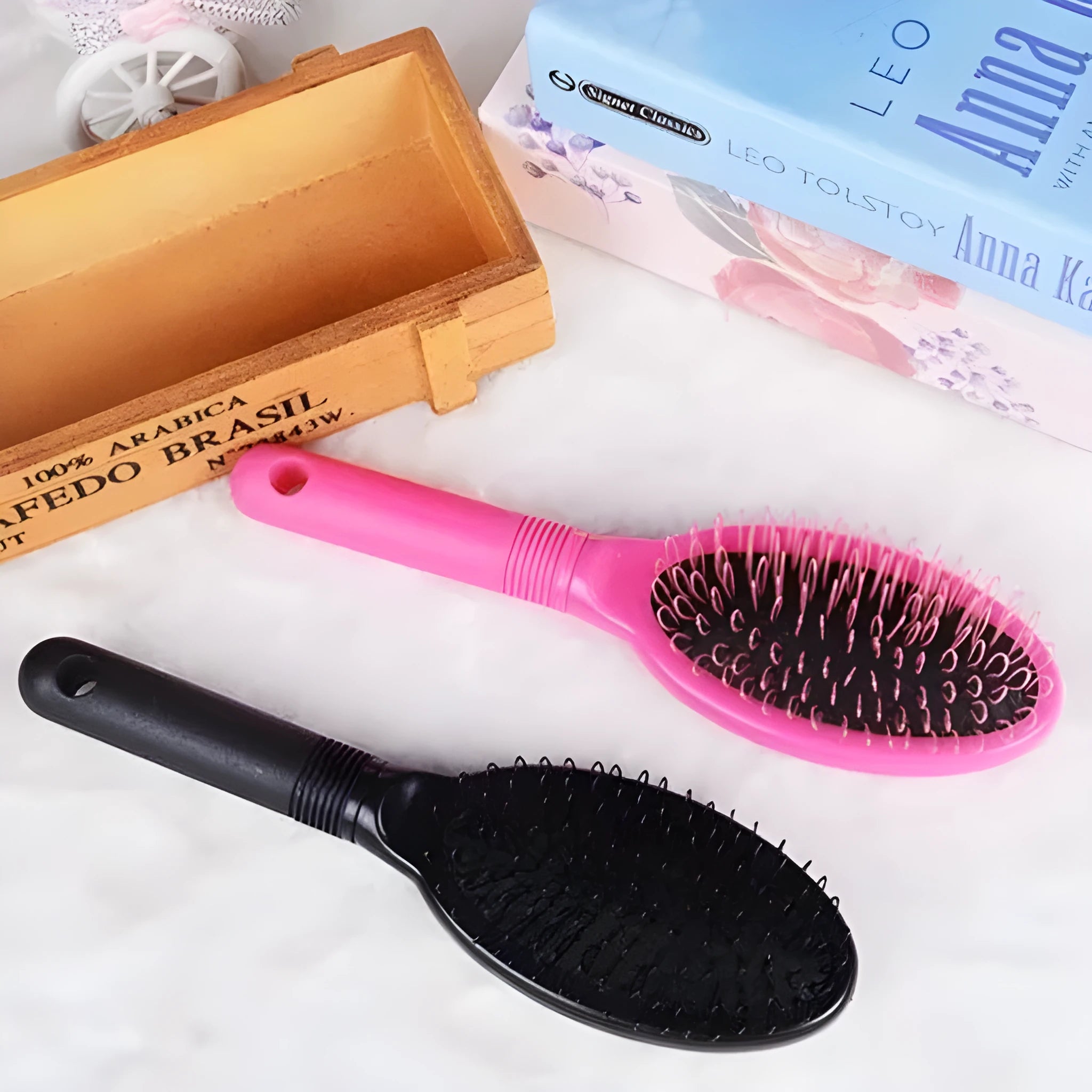 Ring tooth hair extension comb with airbag design measuring 22cm by 6cm in black or pink ABS plastic