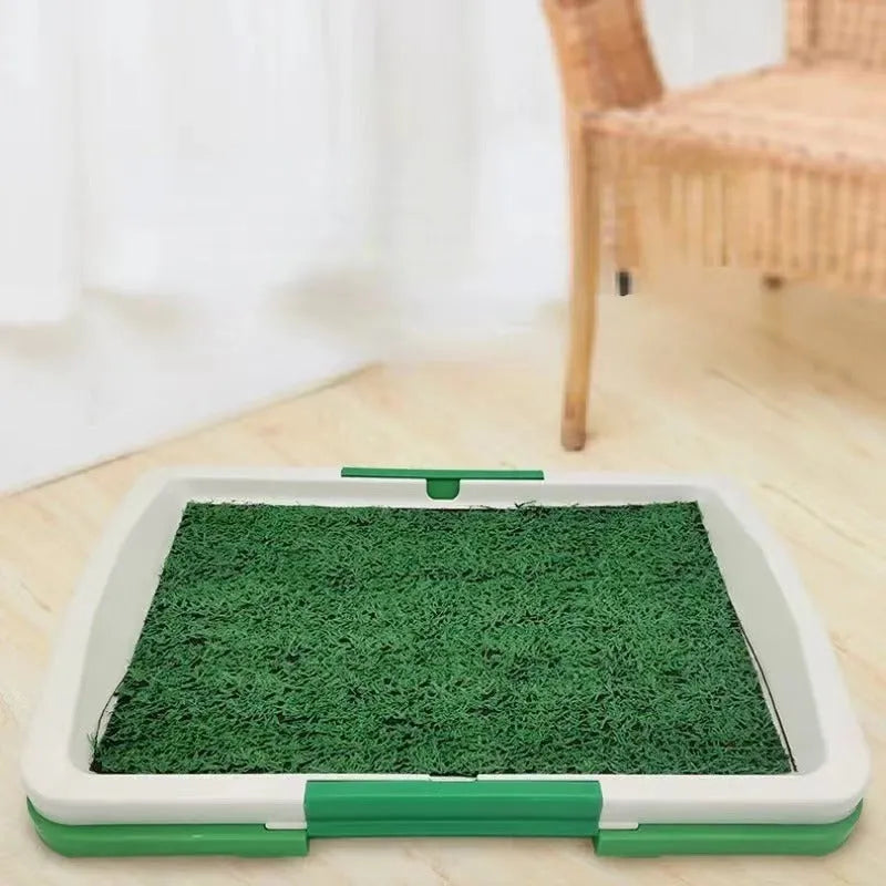 Green artificial turf dog toilet tray with three-layer construction for indoor puppy training.