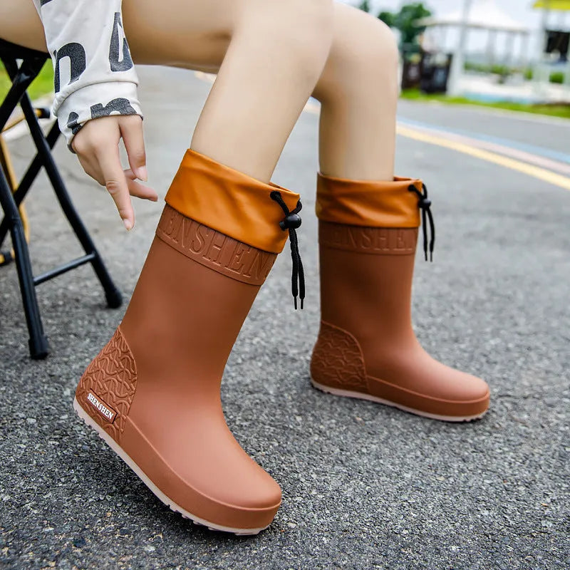 Women's non-slip PVC rain boots in apricot, black, brown and pink colours with wear-resistant soles
