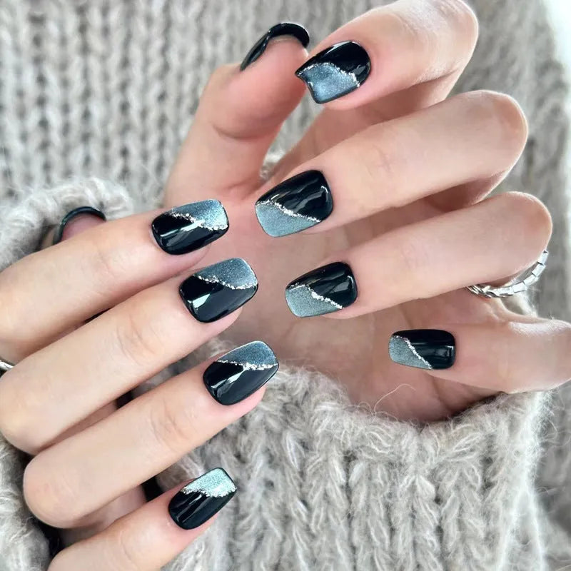 A set of artificial press-on false nails for women in assorted random colours and patterns.