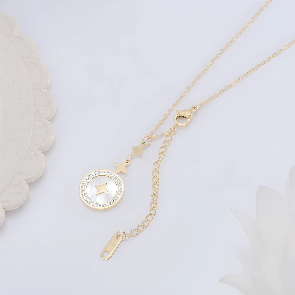 Gold titanium steel necklace with six-pointed geometric star pendant on an O-ring chain.