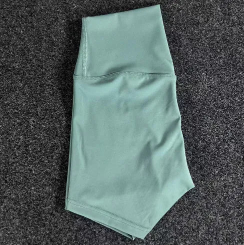 Women's high-waisted nylon yoga shorts in various colours suitable for running, sports, and cycling