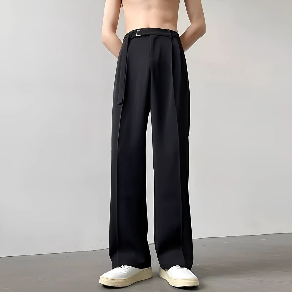 Black wide leg straight trousers with a loose casual fit on a hanger.