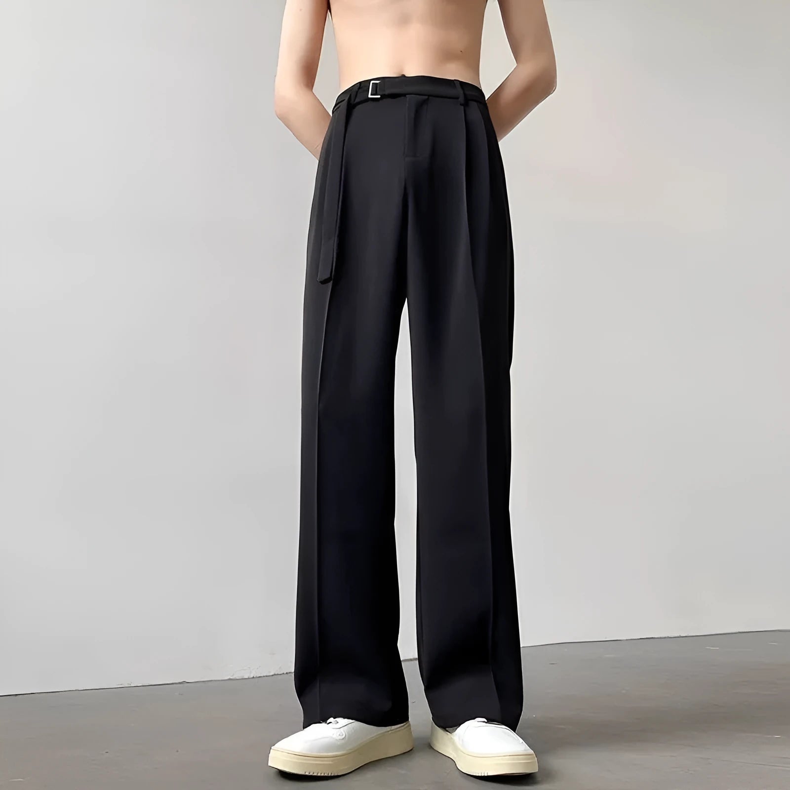 Black wide leg straight trousers with a loose casual fit on a hanger.