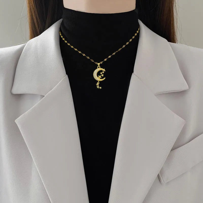 Geometric moon tassel necklace with diamond design in stainless steel and copper