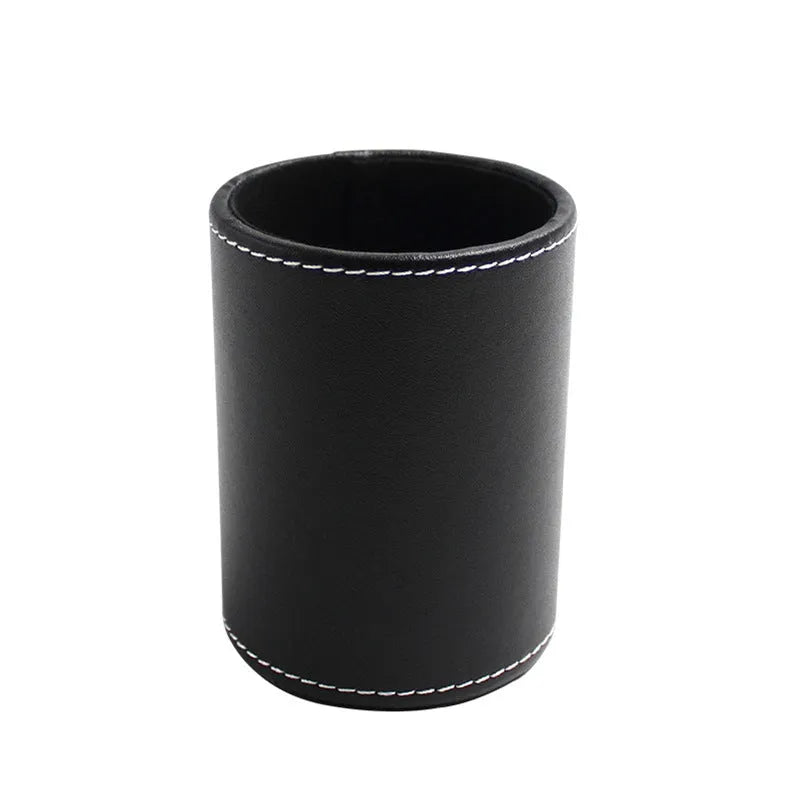 Round black leather pen holder showing cylindrical shape for desk organisation