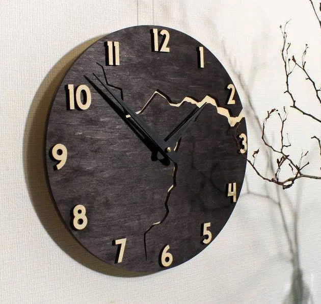 Modern wooden wall clock with creative crack pattern design on white wall