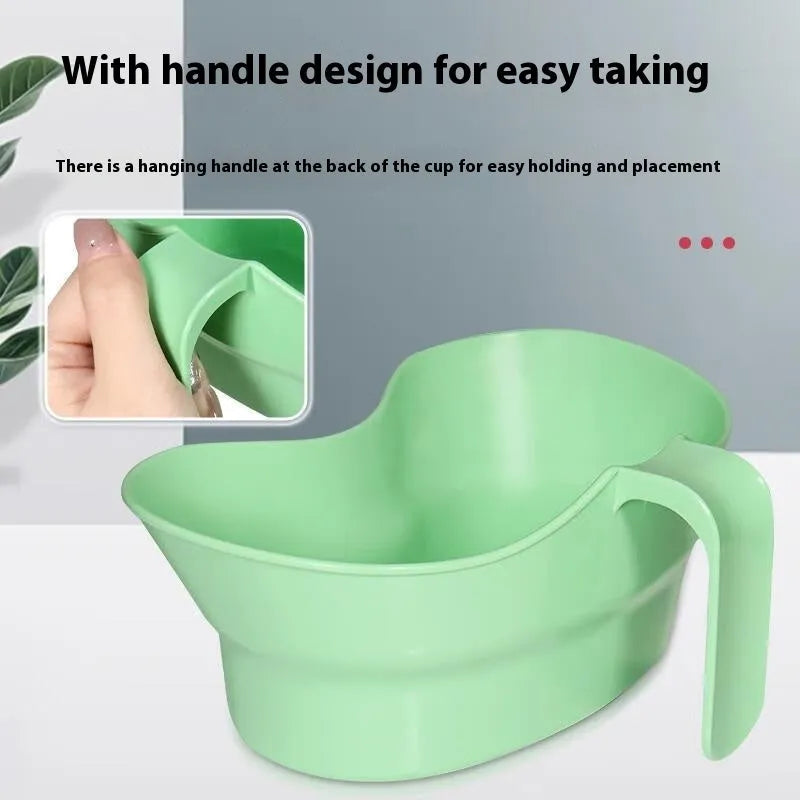 Green plastic nursing gargle cup with specialised spout for bedridden patient oral care