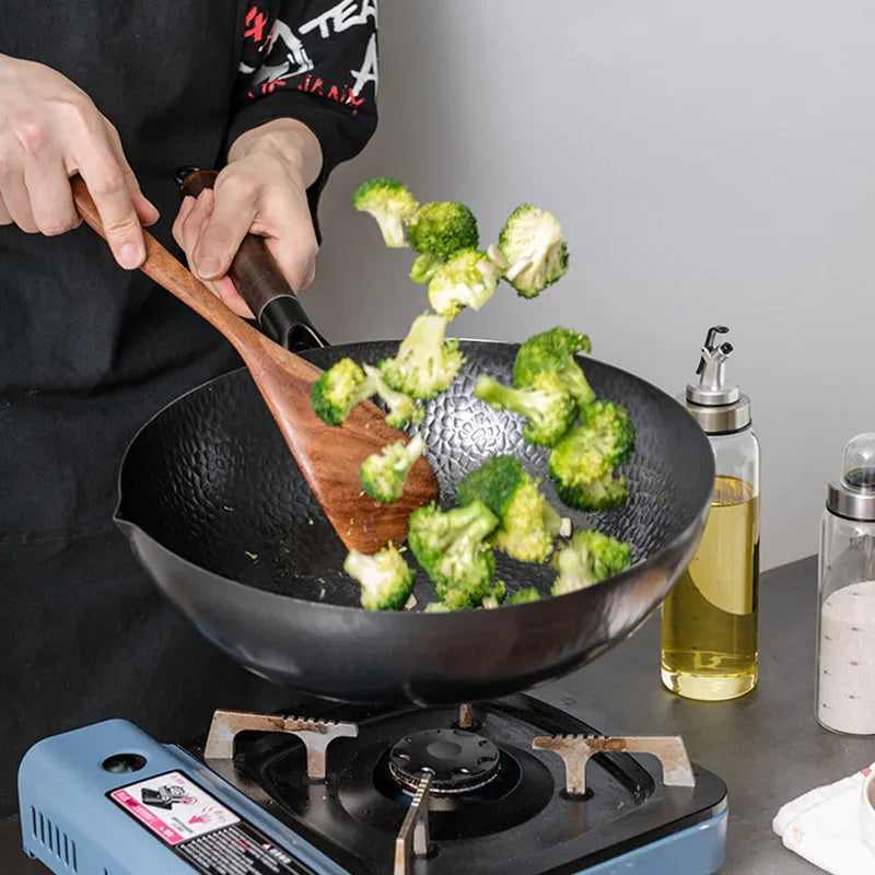 Traditional black iron wok pan with wooden handle measuring 40cm