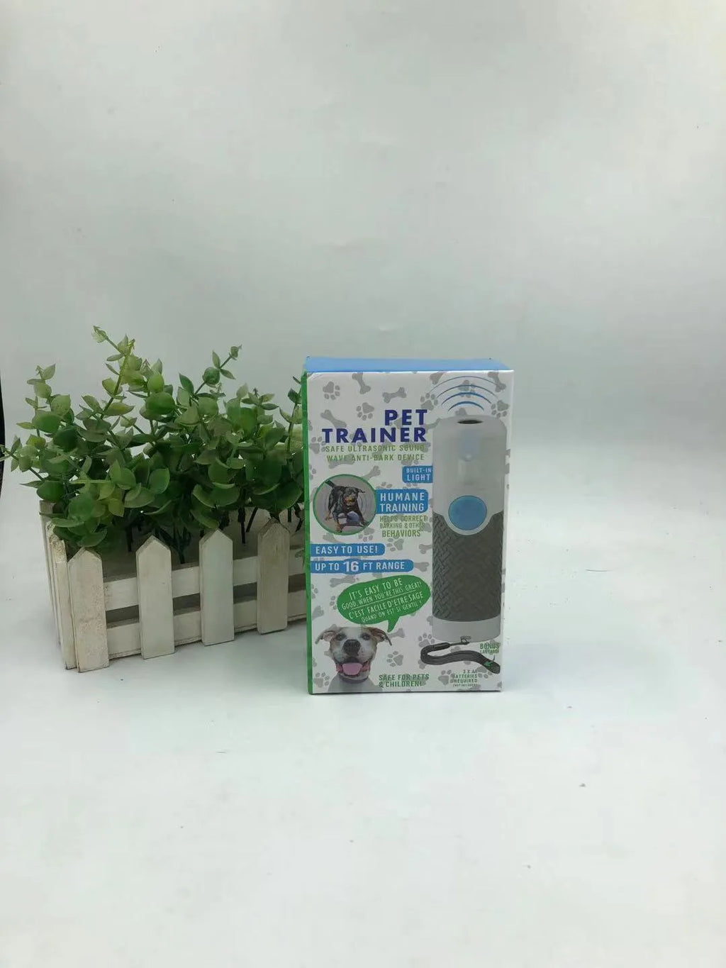 White ABS plastic ultrasonic dog trainer handheld device for bark control weighing 100g