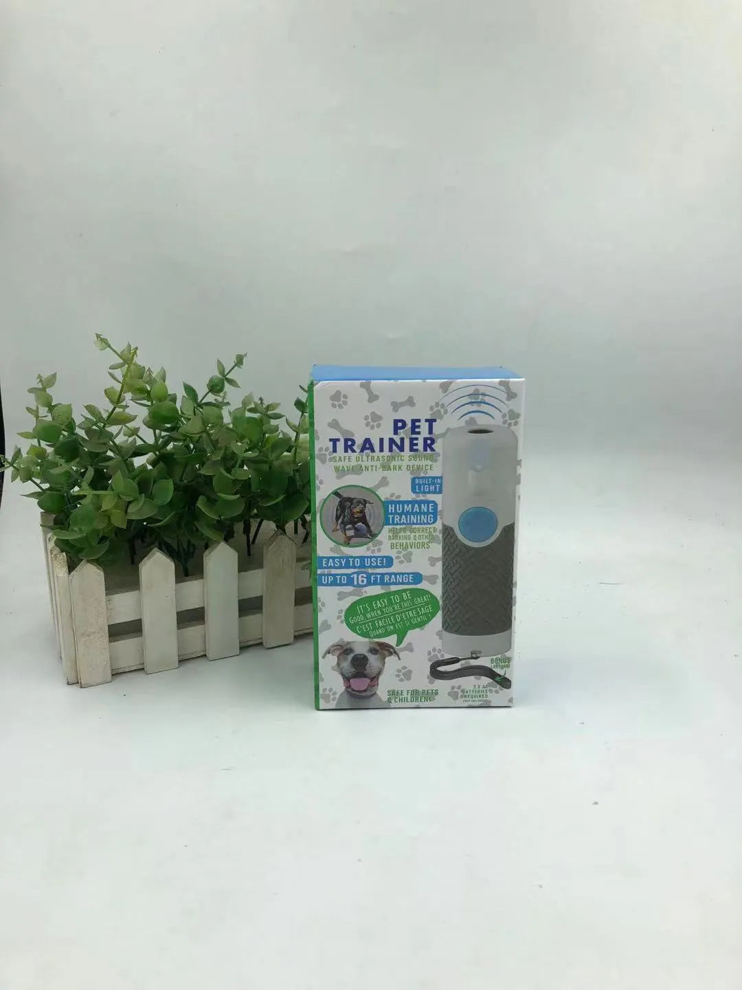 White ABS plastic ultrasonic dog trainer handheld device for bark control weighing 100g